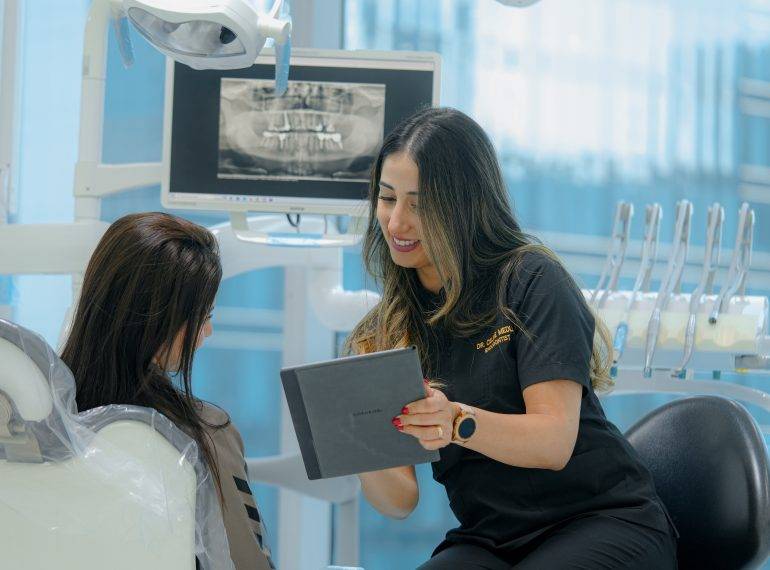 Dentist explaining Dental Implants on Patient 2